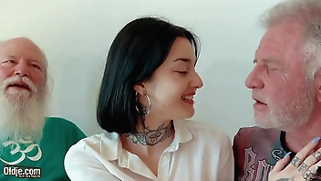 Young brunette has threesome with old men and she swallows cum