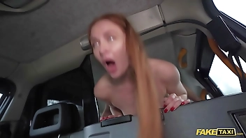 Fake Taxi Redhead MILF in sexy nylons rides a big fat dick in a taxi
