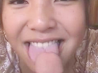 Tokyo Nippon slut sucking her lover's phallus