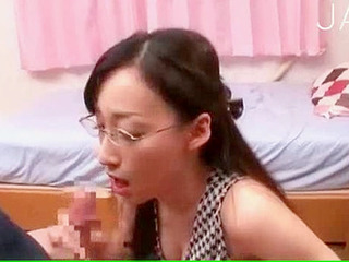 Japanese babe with glasses gets her face fucked